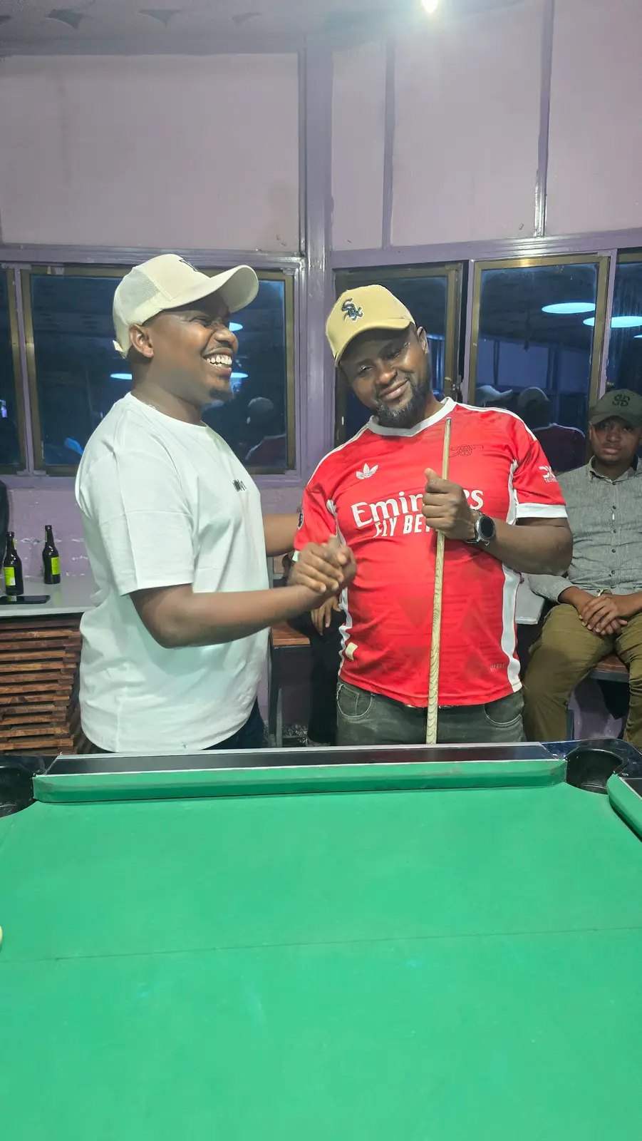Two players shake hands before a match in Loitokitok