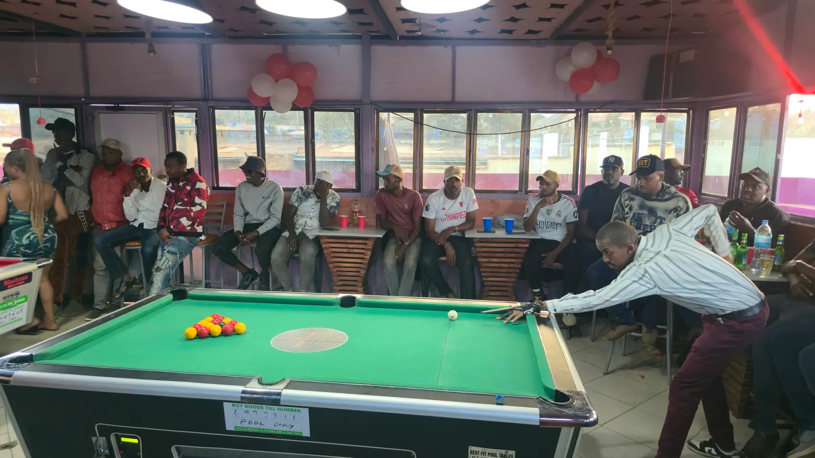 A player lining up a break shot at the Penety Pool Tournament
